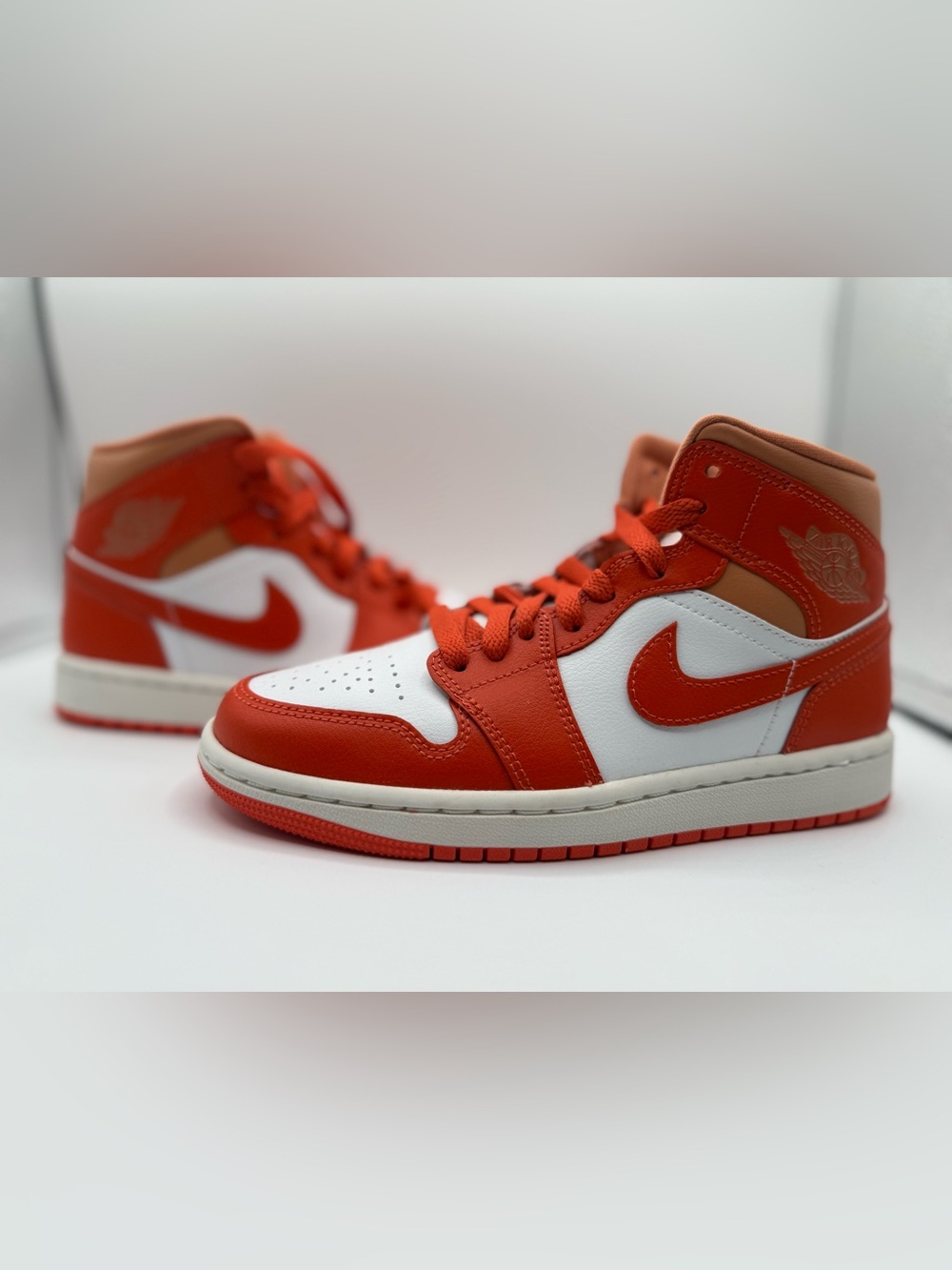 Nike Air Jordan 1 Mid 'Cosmic Clay' women's sneakers in Summit White and orange